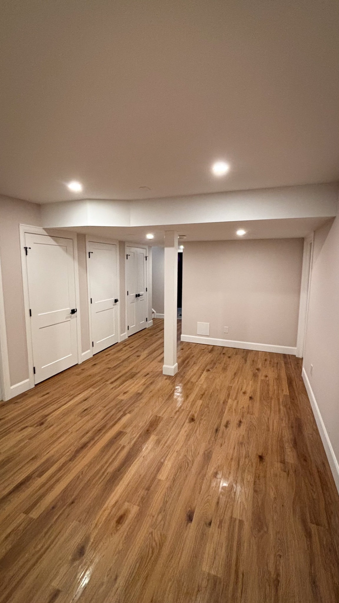 Finished basement hardwood style flooring — Boronka Carpentry Plus