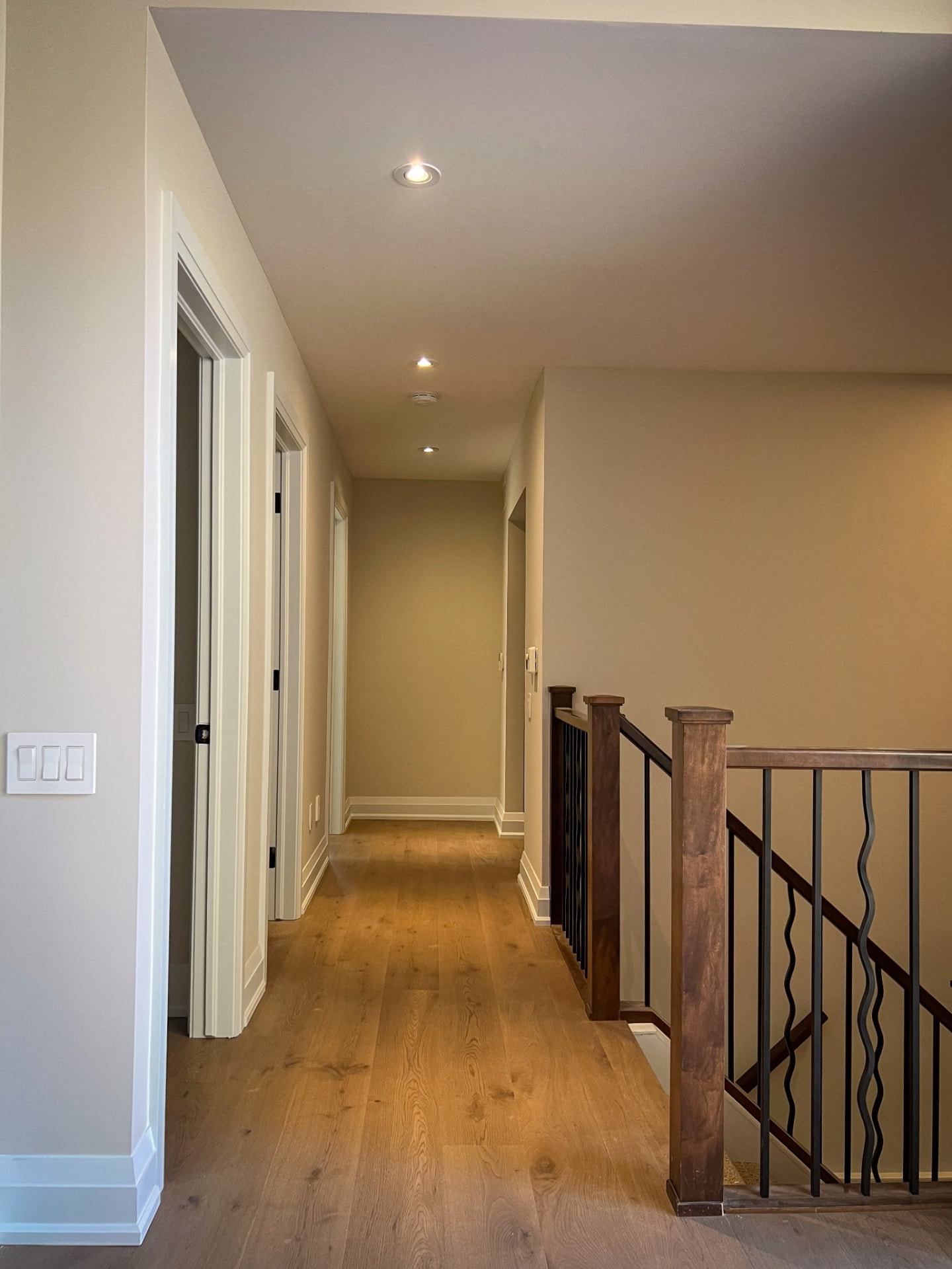Interior renovation hallway and stair railing — Boronka Carpentry Plus